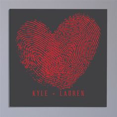 a red heart shaped fingerprint on a black background with the words kyle and lauren