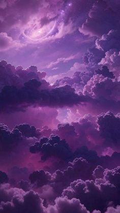 the sky is filled with purple clouds and stars