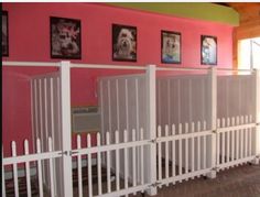 a room with pink walls and white railings