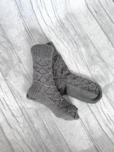 These hand knit socks are so comfortable you'll want to wear them all year long. Our hand knit socks provide a higher quality of craftsmanship, which means you can enjoy them year round, year after year.  Never again will you leave the comfort of your warm bed to be awoken by an ice cold floor beneath your feet. Cuddling up with a blanket in front of the television will no longer be a choice of warm feet or warm shoulders.  You'll no longer need a space heater beneath the desk in your freezing office. Warm the heart, and feet, of a wonderful woman in your life with the gift of these cable knit socks. These cable knit socks are stylish and sleek.  They are knitted from chunky wool yarn and available in 25 beautiful colors. See the photo above for a color chart. Choose your color and size fr Cold Feet Socks, Warm Winter Socks, Cable Knit Socks, Christmas Gifts For Adults, Feet Socks, Hand Knit Socks, Warm Bed, Chunky Wool, Winter Socks