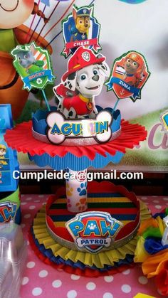 paw patrol themed birthday party with cupcakes and cake toppers on the table