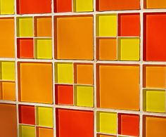 an orange, yellow and red wall with squares in the center is shown against a white background