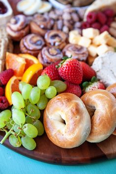 an assortment of fruits and pastries on a platter