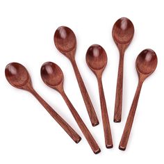 six wooden spoons lined up in a row