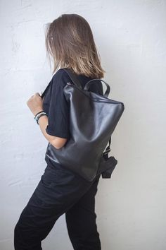 Black Leather Backpack, Upcycled Rucksack, Minimalist AccessoriesThis black backpack purse is made from high quality smooth leather. Zip it and you will find natural lining with open and zipped pocket. LeaF leather backpacks are very light and not overloads your back. If you need to carry only a few things - small backpack is perfect for you.Minimalist design STANDARD (M) size leather backpack fits 15" laptop. FEATURES| One zipped and one open pocket inside| Lining (mostly natural material)| Zip Minimalist Backpacking, Upcycled Handbag, Backpacking Essentials, Convertible Backpack Purse, Upcycled Bag, Simple Backpack, Minimalist Backpack, Black Minimalist, Minimalist Accessories