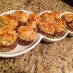 several small white plates filled with food on top of a counter