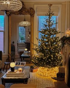 a living room filled with furniture and a christmas tree