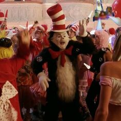 the cat in the hat is surrounded by other people