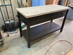 a table with two drawers on it in a room that is being remodeled and remodeled