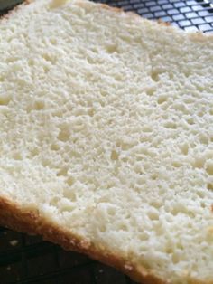 a piece of white bread sitting on top of a cooling rack