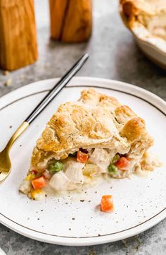 a piece of chicken pot pie on a plate with a fork