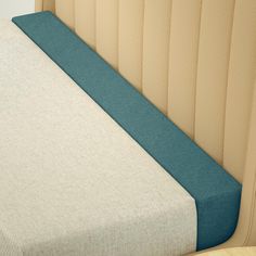 an upholstered headboard and foot board on a bed with no sheets or pillows