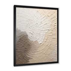 an abstract art piece hanging on the wall in a room with white walls and black frame