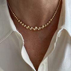 "This stunning graduated necklace is crafted with 14K yellow gold filled round beads from 4-10mm.   The overall design results in a well balanced piece of modern charm that is rich looking yet conservative in appearance, worthy of any occasion.  We offer this necklace in lengths from 14\" up to 18\" AND as a set of three necklaces as shown in the photos: Set 1: 14\" Graduated Gold Filled Necklace 16\" 3mm Round Pearl Necklace 18\" 3.1mm Gold Filled Paperclip Necklace Set 2: 16\" Graduated Gold F Luxury Formal Chain Necklace With Round Beads, Cheap Gold Crystal Necklace With Round Beads, Luxury Delicate Chain Necklace With Round Beads, Luxury Gold Beads Necklace For Celebration, Luxury Classic Necklace With Gold Beads, Luxury Gold Plated Necklaces With Round Beads, Gold Beaded Necklaces For Anniversary, Gold Beaded Necklace For Anniversary, Luxury Gold Bridal Necklace With Round Beads