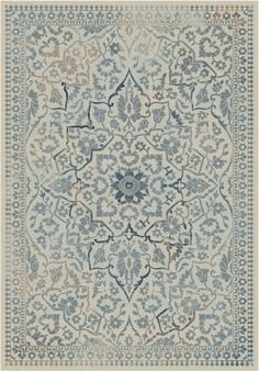 a blue and white rug with an intricate design