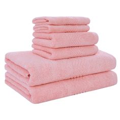 six pink towels stacked on top of each other in front of a white background,