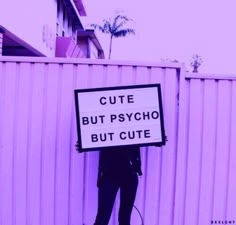 a person holding a sign that says cute but psychic but cute