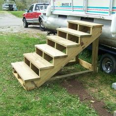 a truck parked next to a set of stairs