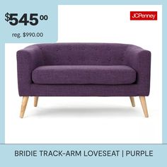 a purple couch sitting on top of a white floor next to a blue wall with the words, $ 545 00 reg $ 990 00