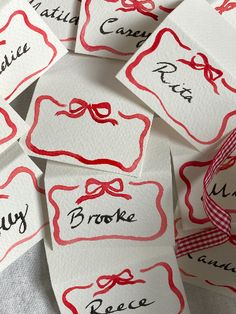 many name tags with bows on them are shown in red and black ink, along with the names of each individual party guests