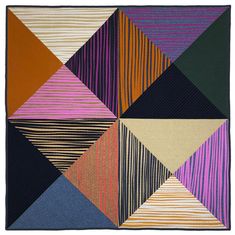 an abstract quilt with different colors and patterns