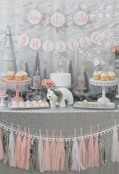 a table with cake, cupcakes and decorations on it