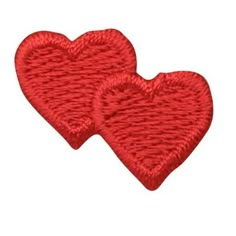 two red hearts are shown in the shape of an embroidered applique on a white background