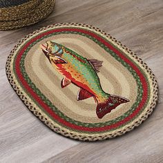 a fish rug is on the floor next to a basket