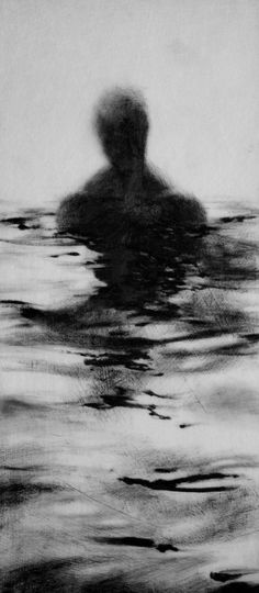 a black and white photo of a person in the water with his back turned to the camera