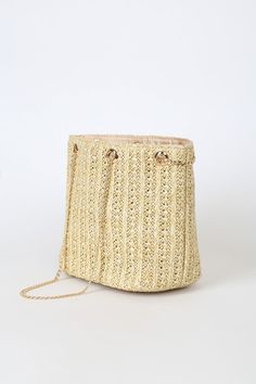 When the journey is just as important as the destination, make sure to stay stylish every step of the way! The Lulus Miles to Go Beige Straw Mini Bag has a bucket-style silhouette, composed of intricately woven straw. Gold chain threads through matching aglets and can convert this little purse into a crossbody or a shoulder bag for a versatile vacay look! Lined interior has a zippered sidewall pocket. Lined. Bag Measures 10. 25" Wide, 7. 25" Tall, And 5. 25" Deep. 53" Gold Chain Strap. Strap Has Beige Crochet Bucket Bag For Day Out, Beige Bucket Crochet Bag For Day Out, Braided Bucket Shoulder Bag For Spring, Jute Bucket Bag For Vacation, Gold Straw Shoulder Bag For Summer, Gold Summer Travel Bucket Bag, Woven Tote Bucket Bag For Day Out, Beige Straw Bucket Bag For Travel, Gold Straw Bag For Summer Travel