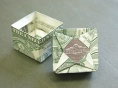 two origami boxes with money in them