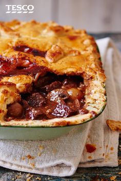 a close up of a pie in a dish on a napkin with the crust removed