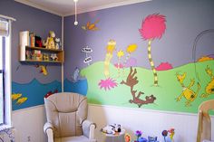 a child's room with dr seuss and the cat in the hat mural