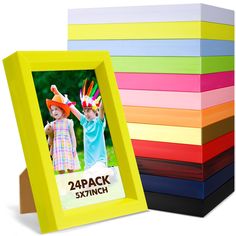 a stack of multicolored cardboard boxes with an image of two children in hats