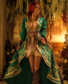 a woman in a green and gold costume