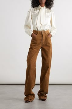 Find SAINT LAURENT Cotton-corduroy High-rise Wide-leg Pants on Editorialist. SAINT LAURENT's pants have elongated wide legs that pool at the floor, creating a slouchy look when styled with pointed pumps or boots. They're cut from soft cotton-corduroy in neutral brown and sit comfortably high on the waist. Vintage Chic Outfits, Khaki Corduroy Pants, Corduroy Pants Outfit, Corduroy Pants Women, Pointed Pumps, Cords Pants, Pantalon Large, Knitwear Tops, Wide Legs