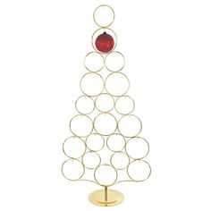 a christmas tree made out of circles with a red ornament on the top