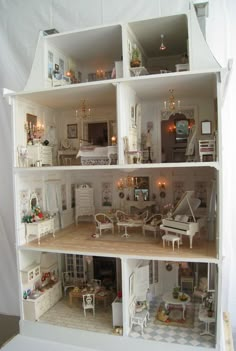 a doll house with furniture and accessories in it