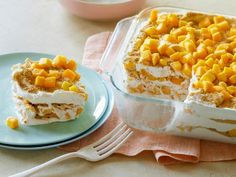 there is a cake that has been cut into pieces and served on a plate with a fork