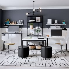 a modern office with black and white decor