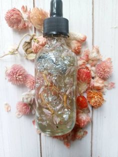 This spell oil is designed to enhance your natural beauty and to be used in Glamour Spells to appear attractive/beautiful and get attention plus compliments.  Perfect to use while going out on a date to get the attention of your lover or in a beauty spell or ritual. Spell oil tip annoit your beauty mirror to help raise your confidence and self esteem Made with silver flakes and herbs plus essential oils Charged with Rose Quartz. 🪞💋 Sold as curio only. Beauty Spell Jar Recipe, Spell Jar For Beauty, Beauty Spell, Beauty Spell Jar, Glamour Magick, Spell Jar For Confidence, Glamour Spell, Magick Oil