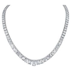 Elevate your elegance with our exquisite 19-inch Graduated Tennis Necklace, meticulously crafted in platinum and adorned with captivating emerald-cut diamonds. Each diamond is expertly set in a secure four-prong setting, showcasing their brilliance and clarity. The focal point of this masterpiece is the GIA certified H/SI2 emerald center, weighing 1.51 carats, radiating with unparalleled beauty and sophistication. With a total diamond weight of 30.04 carats, this necklace is a true statement of Luxury Prong Setting Necklace, Luxury Formal Baguette Cut Tennis Necklace, Emerald Cut Necklace, Riviera Necklace, Diamond Tennis Necklace, Sparkly Things, Emerald Cut Diamond, Chicago Pd, Tennis Necklace