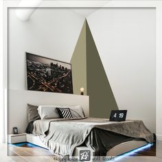 a bedroom with a bed, night stand and pictures on the wall above it that are also lit up