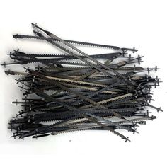 a pile of black and silver scissors sitting on top of each other