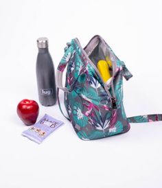 With its thermal insulation, this bag is the perfect work or school carry-along. Not only will it keep your food cool on the hottest of days, but it is also easy to clean. This tote includes an adjustable shoulder strap and unique designs to add a pop of color to your day. #LugLife #BotanicalMulti #LunchBag #Lunch #WomensFashion Garden Tote, Insulation, Convertible, Color Pop