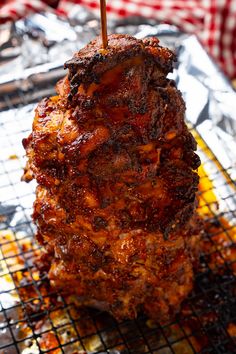 the meat is being grilled on the grill with a toothpick in it