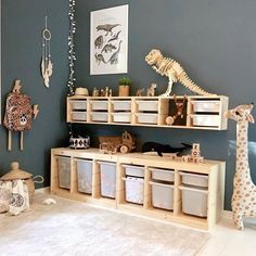 a child's playroom with toys and stuffed animals on shelves in the corner