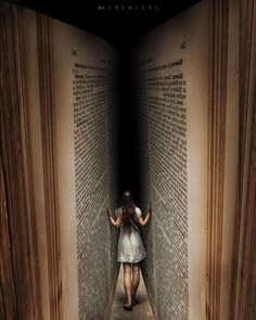 a woman is walking through an open book