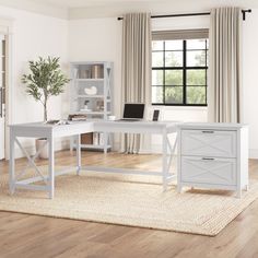 a white desk sitting on top of a hard wood floor next to a book shelf