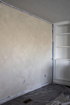 an empty room is being painted white